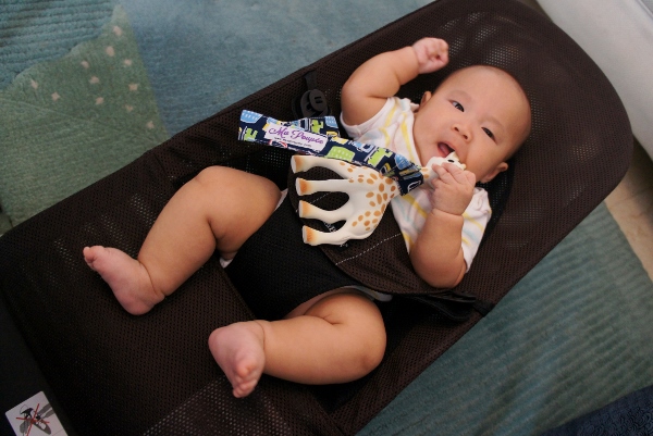 David chilling in a BabyBjorn bouncer